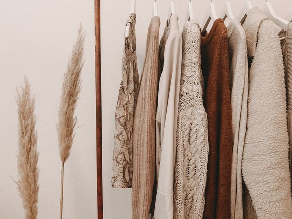 What are the key elements of a transitional season wardrobe?